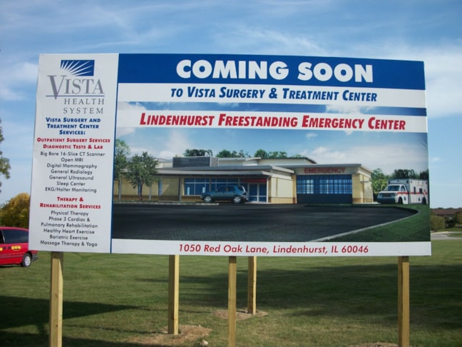 Post and panel construction site sign with elevation drawing, architect and builder information