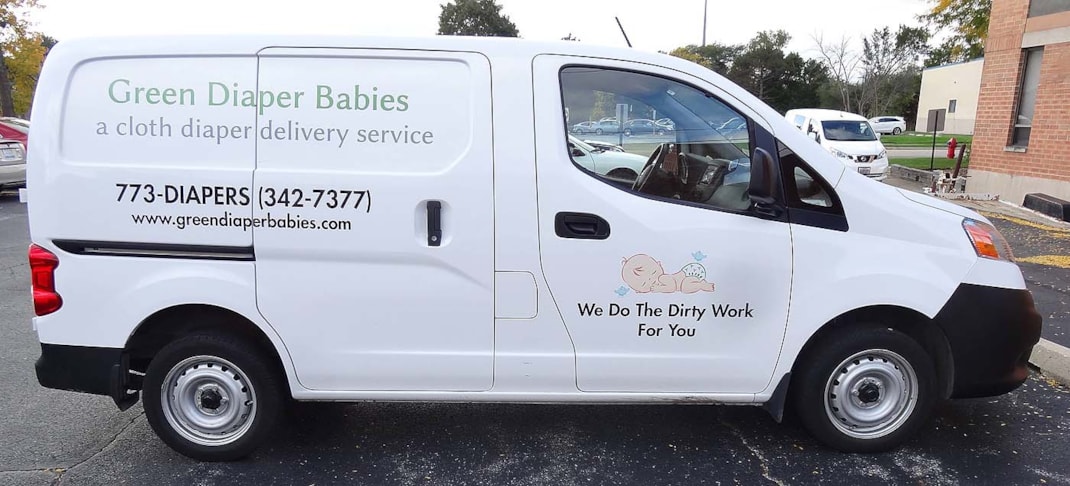 Delivery van with lettering and printed graphics for Green Diaper Babies.  Chicago, IL