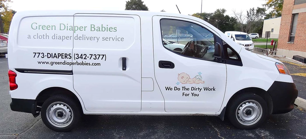 Delivery van with lettering and printed graphics for Green Diaper Babies.  Chicago, IL