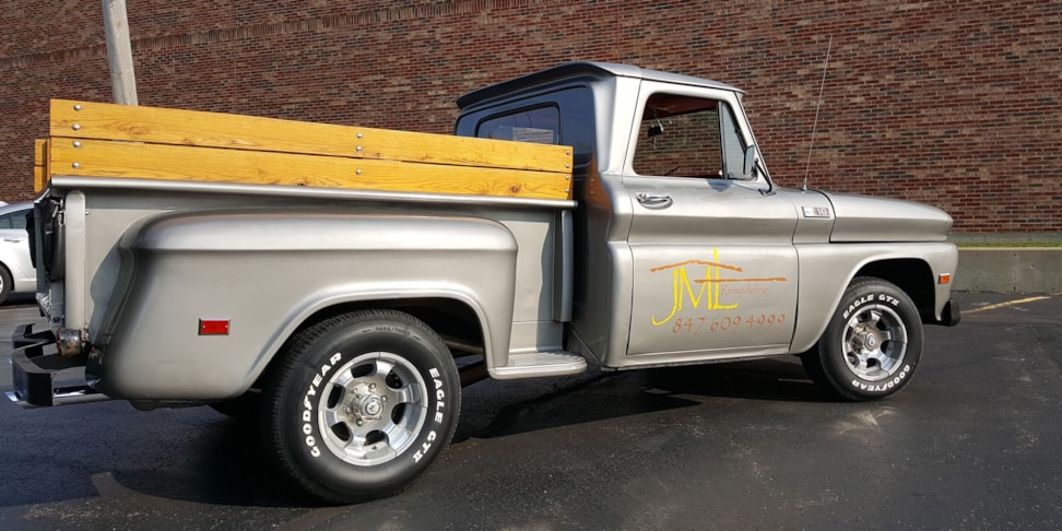 1965 Chevrolet truck with letters and phone number on door in yellow and metallic copper