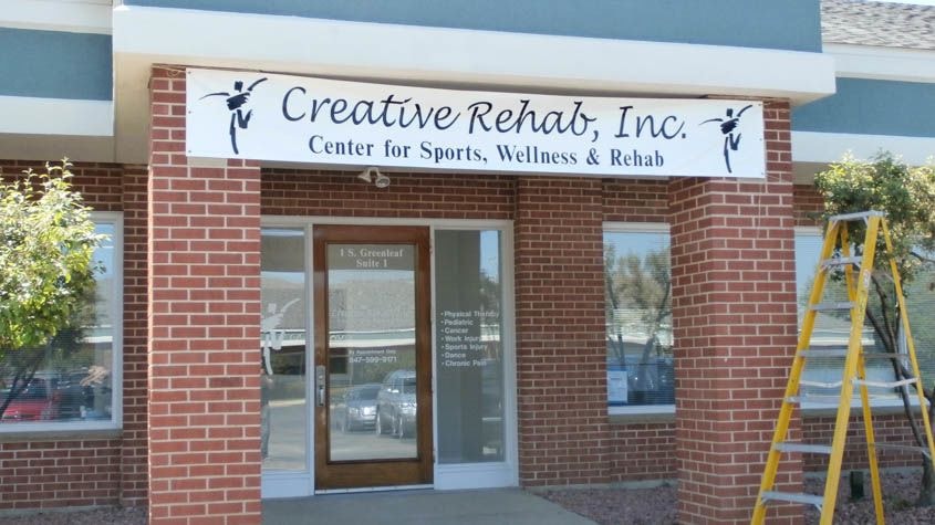 This banner was put up short term at a physical therapy doctors office until permanent dimensional lettering could be installed.