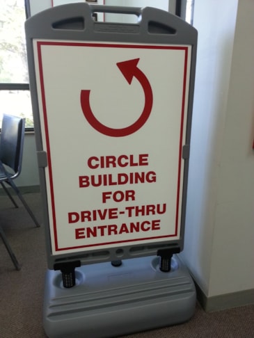 Outdoor sign with weighted base 