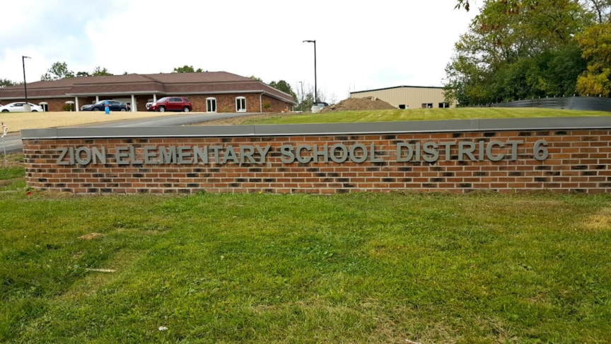 Cast aluminum letters on brick wall  