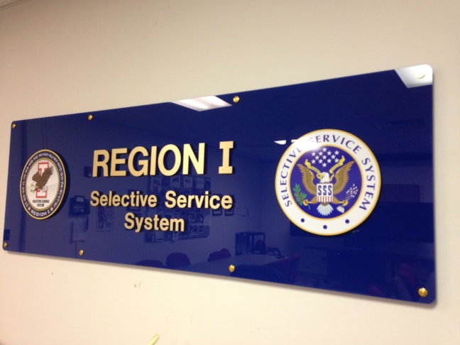 Three dimensional letters and logos on acrylic with standoffs in conference room serves as background for video conferencing