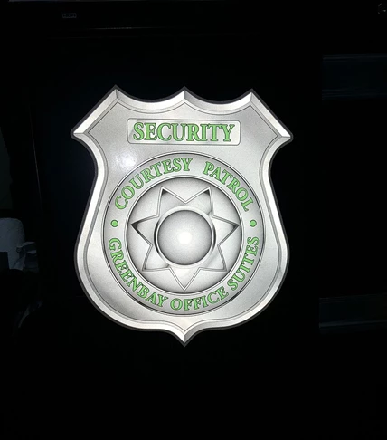 Reflective decal of badge on security car 