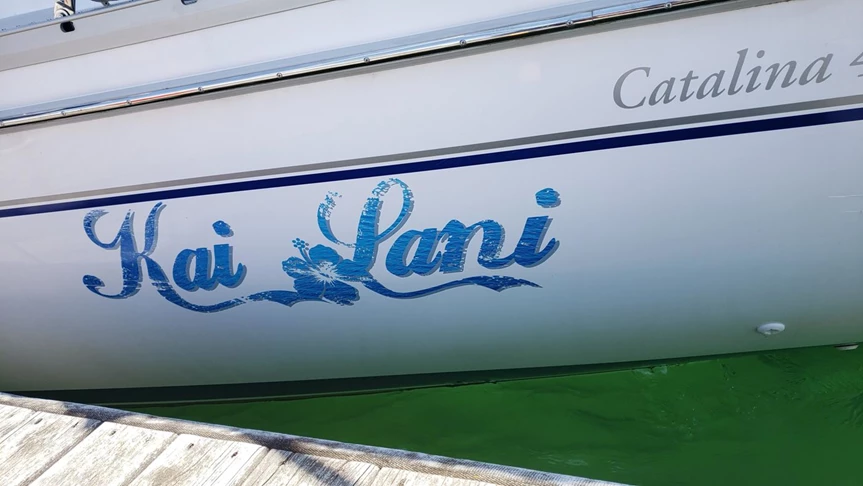 Sail boat name and graphics.  Print with laminate and machine die-cut