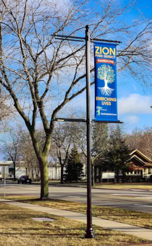 Fabric Outdoor Banner on street pole with arms supplied by IMAGE360