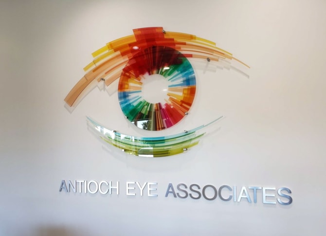 Logo with printed translucent acrylic panels and brushed metal dimensional letters