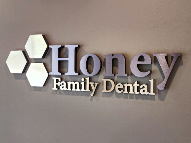 Logo on reception wall - brushed metal on acrylic and foam