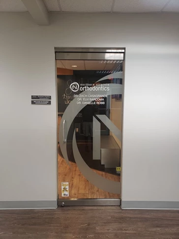 Northern Virginia Orthodontics needed a doctors name removed from their door, and some etched vinyl of their logo added.