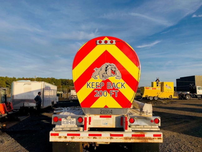 Top Dog needed some branding on their tanker truck. We installed their name and logo to the sides and rear.