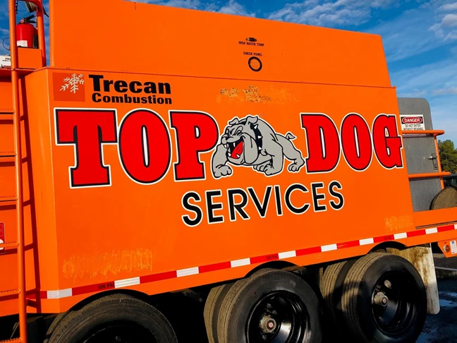 Top Dog got some new machinery and needed more branding. This logo pops on that orange!