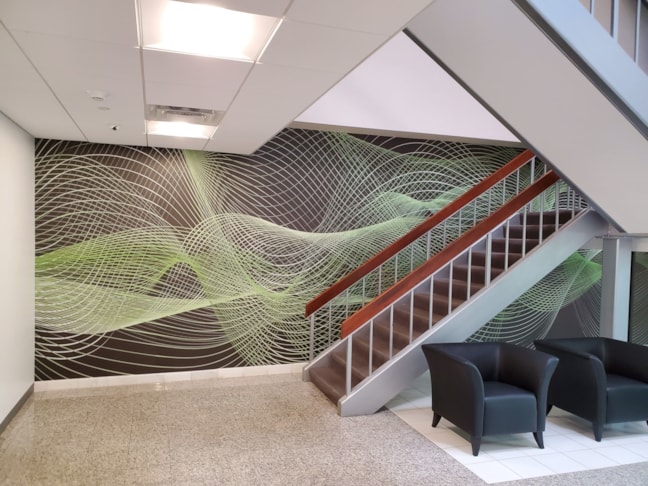 Large wall graphic installed at Compu Dynamics. This wall graphic is 27 feet long and 10 feet tall.