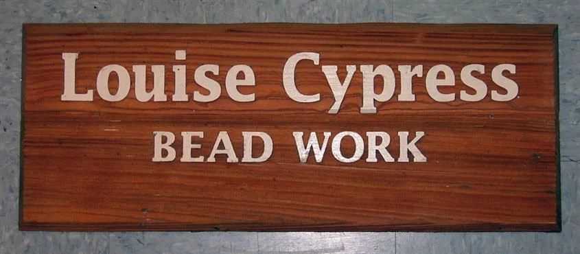 Natural redwood - sandblasted, painted text, clearcoated background