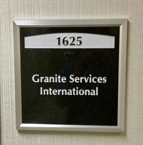 One Tampa City Center Suite Plaque. Copy Engraved into Stone Plaque and Paint Filled with Braille Copy at the Bottom.