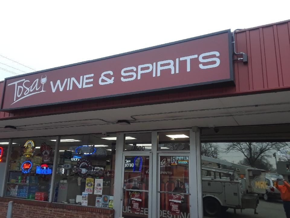 Storefront signs Tosa Wine