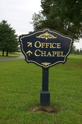 Carved post and panel signs