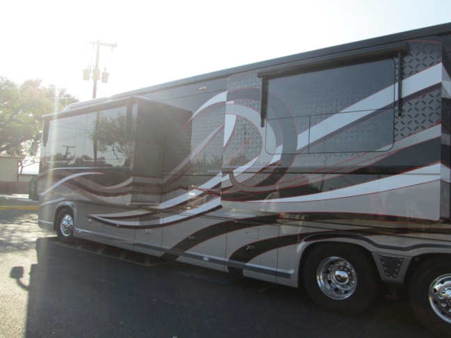 Complete custom window graphics designed and installed here at Image360 San Antonio west.  these were completely created from scratch to match the custom graphics on this beautiful motohome.