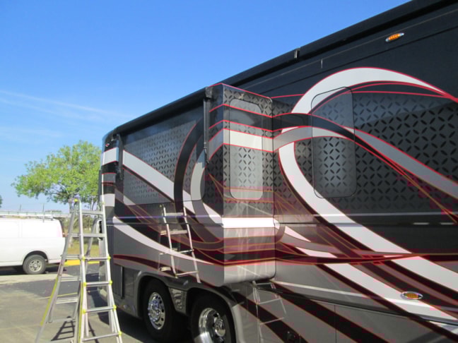 Complete custom window graphics designed and installed here at Image360 San Antonio west.  these were completely created from scratch to match the custom graphics on this beautiful motohome.